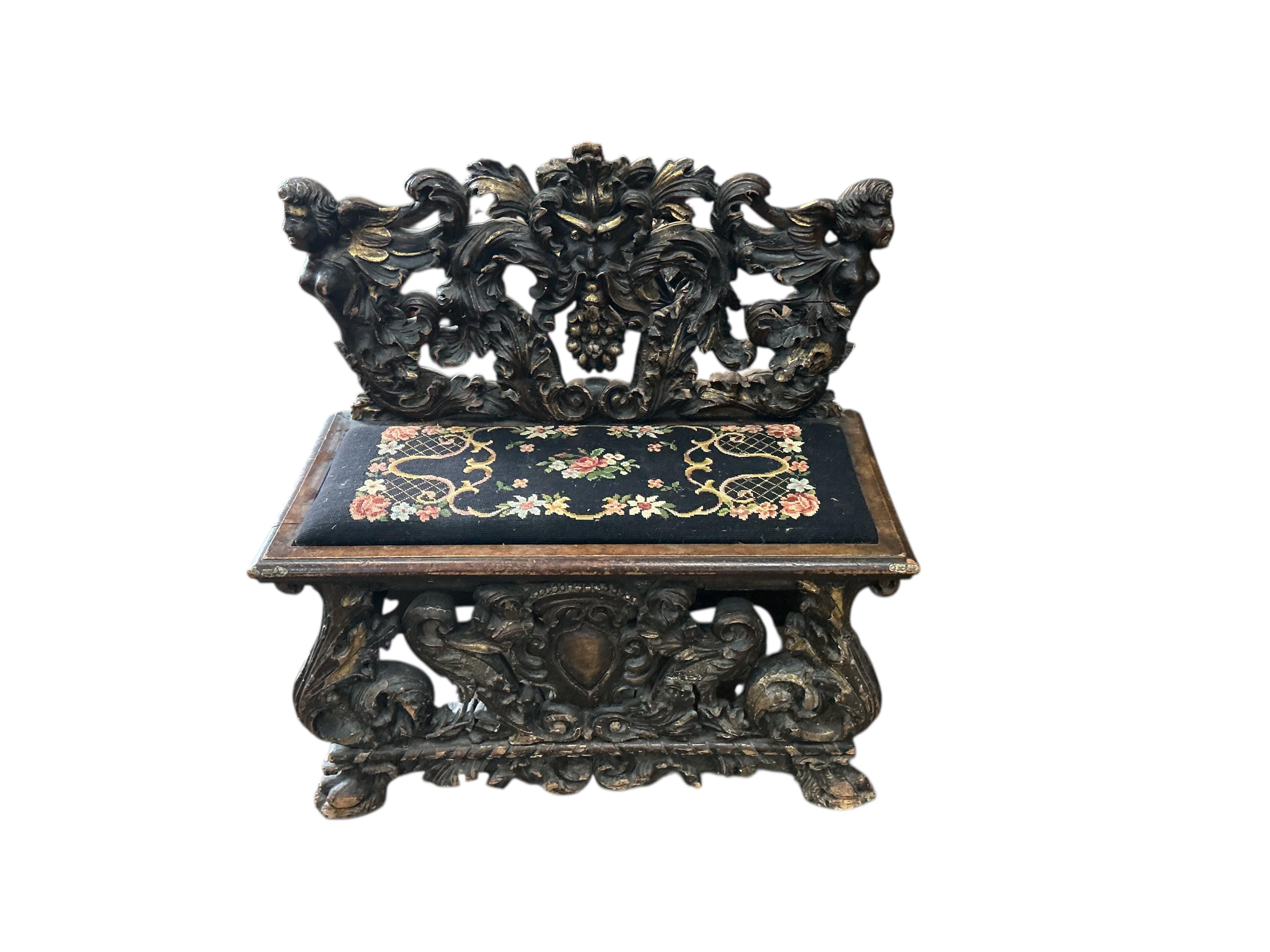 A 19th century Italian giltwood and later painted carved bench, width 95cm, depth 46cm, height 92cm